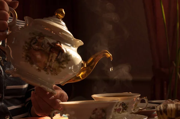 Green tea In a kettle with gilding — Stock Photo, Image