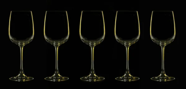 Silhouette of wineglass with yellow illumination — Stock Photo, Image