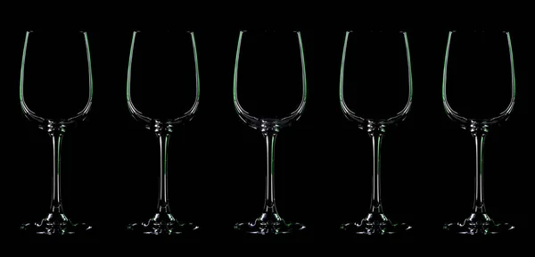 Silhouette of wineglass with green illumination — Stock Photo, Image
