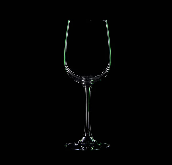 Silhouette of wineglass with green illumination — Stock Photo, Image