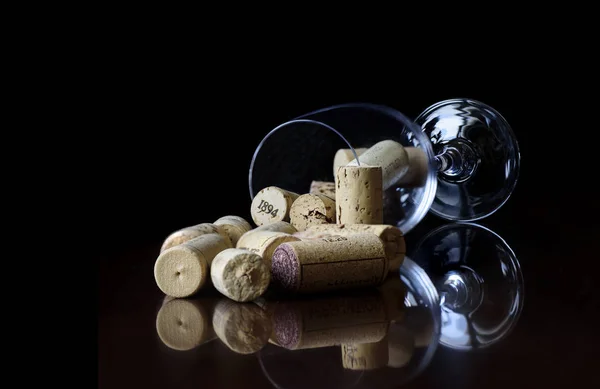 Wine glass with wine stoppers — Stock Photo, Image