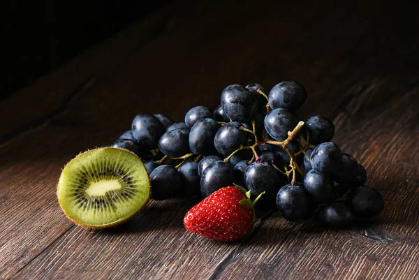 Berries are on a wooden table — Stock Photo, Image