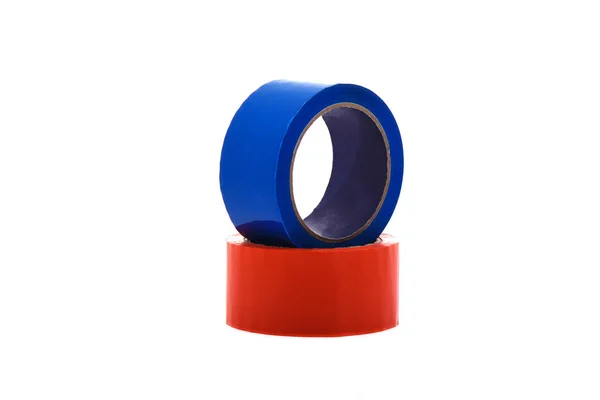 Red and blue rolls of duct tape isolated on white background. — Stockfoto