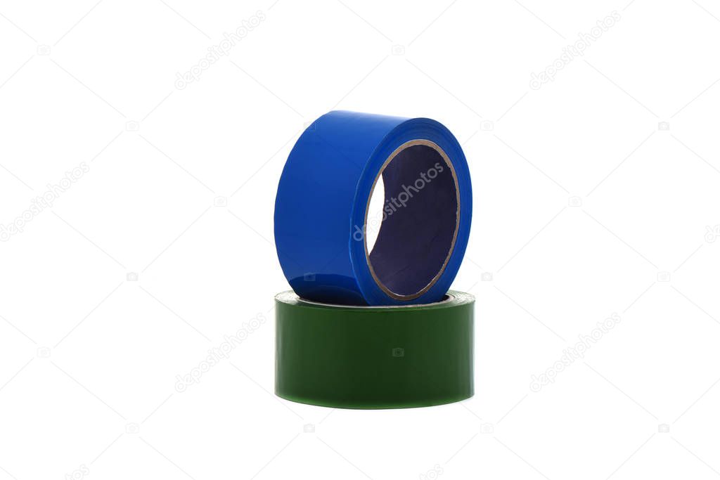 Green and blue rolls of duct tape isolated on white background.