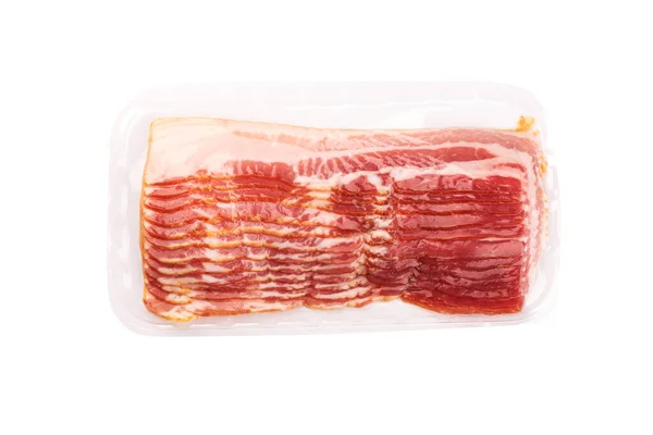 Vacuum packed bacon rashers isolated on white background. Royalty Free Stock Images