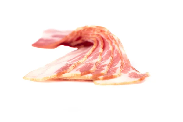 Selective focus. Rashers of bacon isolated on white background. — Stock Photo, Image