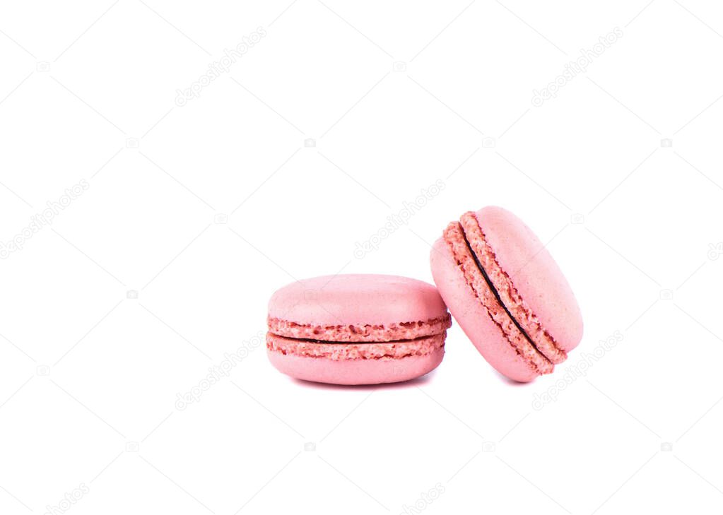 Two pink macaroon isolated on a white background.