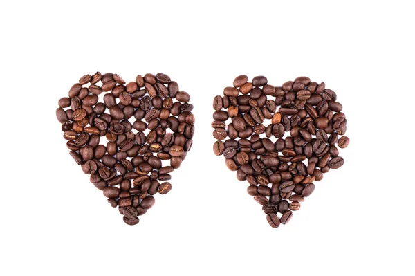 Granos de café en forma de dos corazones . — Foto de Stock