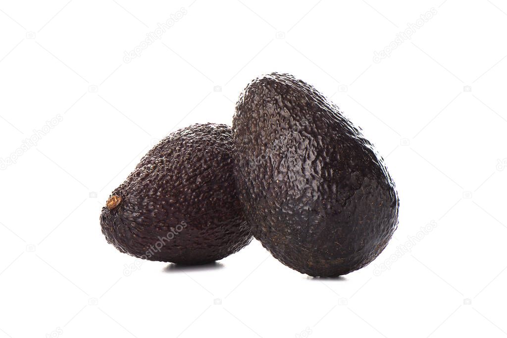 Two haas avocado fruits isolated over the white background.
