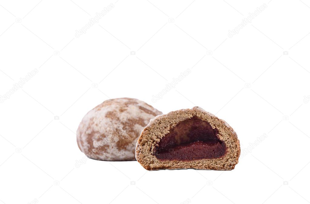 Glazed gingerbread with fruit filling isolated on a white background. Gingerbread in a cut with fruit jam. Copy space.