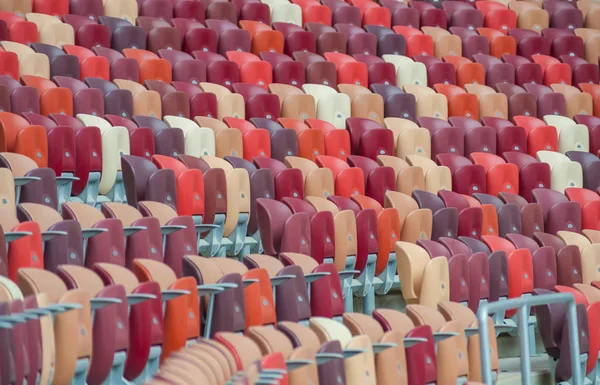 Multi-colored armchairs in a sports stadium