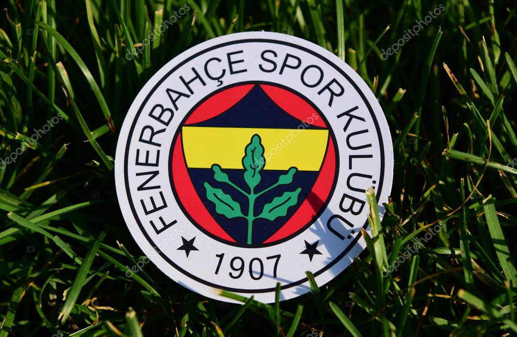 September 6, 2019 Istanbul, Turkey. The emblem of the Turkish football club Fenerbahce Istanbul on the green grass of the football field.