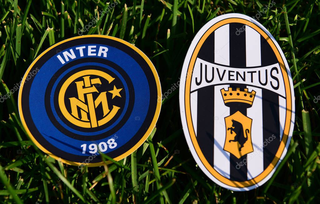 September 6, 2019, Turin, Italy. Emblems of Italian football clubs Juventus Turin and Internazionale on the green grass of the lawn.