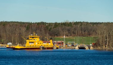 Yellow ferry for transporting cars and people from the islands of the Stockholm archipelago to the mainland