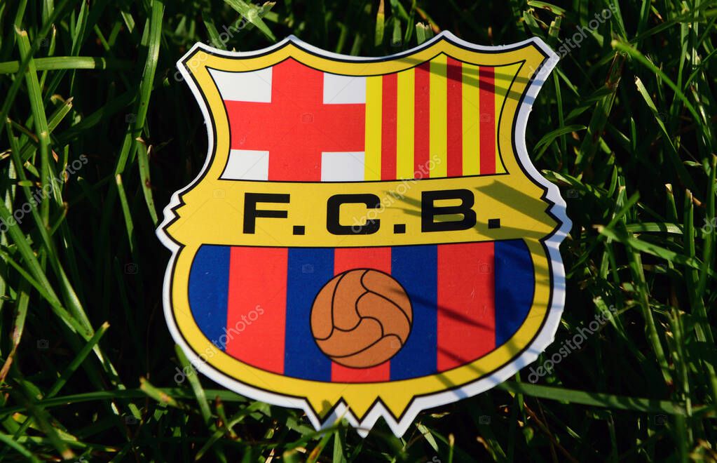 September 6, 2019 Istanbul, Turkey. The emblem of the Spanish football club Barcelona on the green grass of the football field.