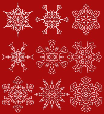 Bir dizi çizilmiş kar tanesi silueti