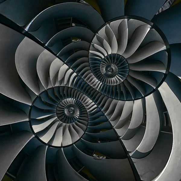 Turbine blades wings surreal spiral effect abstract fractal pattern background. Spiral industrial production metallic turbine background. Gray turbine blades technology abstract fractal pattern