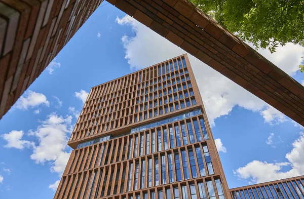 MOSCOW, JUN,28. 2017: Veiw on new loft style modern building made of brown bricks with big wide windows EGODOM. Rectangular building architecture. Russian modern loft architecture. Luxury real estate