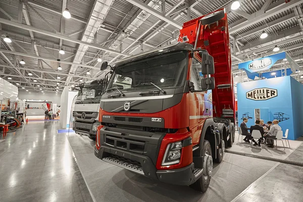 MOSCOW, SEP, 5, 2017: View on Volvo dump truck exhibit on Commercial Transport Exhibition ComTrans-2017. Volvo commercial transport on exhibition stand booth. New modern commercial dump trucks cars — Stock Photo, Image