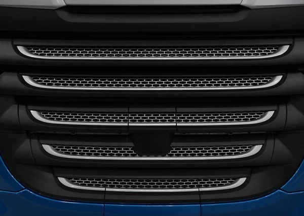 Close up truck cabin radiator cover with grid grille. Car radiator grille background pattern. Industrial pattern truck grill grid background, car radiator hood. Truck engine grille hood