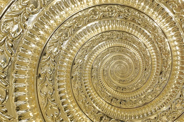 Golden metal abstract spiral background pattern fractal. Decorative ornament element. Golden metallic decorative ornament element. Gold metallic background pattern. Vintage golden metal background