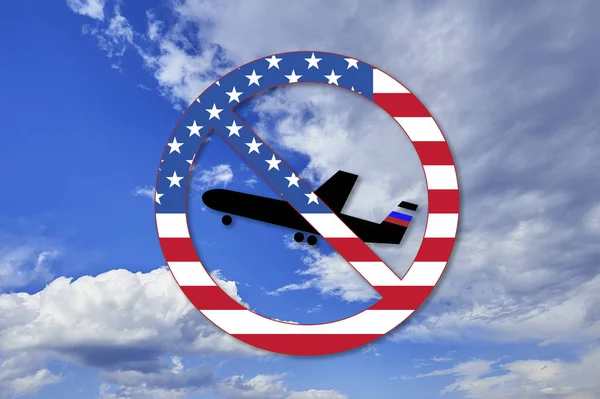 Dirty politics conceptual image. USA sanctions against Russia. US embassy blocks American visas for Russian pilots. Forbidden circle in USA flag colors with plain symbol with sky in the background