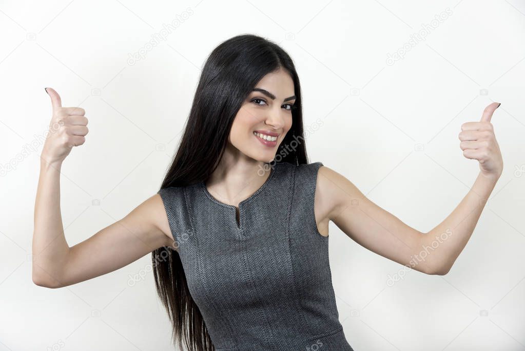 Businesswoman showing thumbs up.
