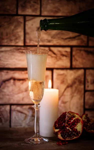 A glass of champagne and pomegranate — Stock Photo, Image