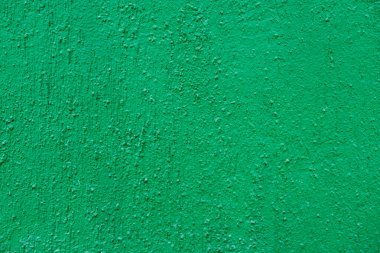 Doku arkaplanı için boş beton duvar yeşili rengi. Yeşil renklerle boyanmış kabataslak duvar arkaplanı.