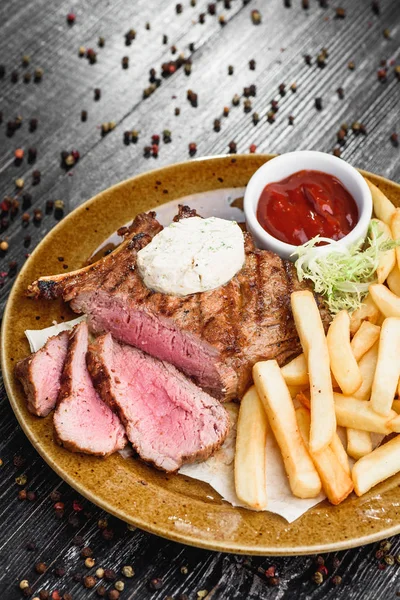 Beef steak on wooden table — Stock Photo © Kesu01 #44686565