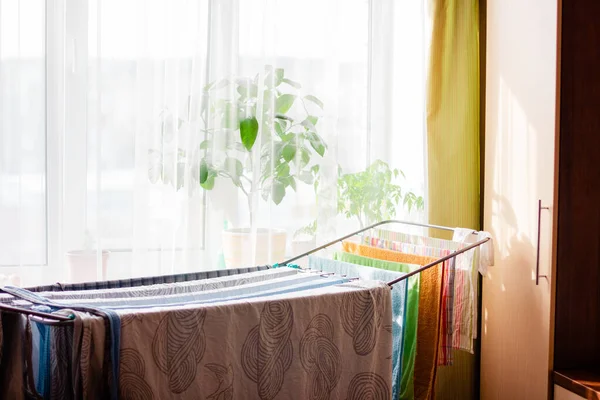 Drying rack for clothing with colorful linen