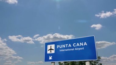 Punta Cana, Dominik Cumhuriyeti 'ne Jet uçağı iniyor. Havaalanı istikameti işaretli şehir gelişi. Seyahat, iş, turizm ve ulaşım konsepti. 3B canlandırma canlandırması.