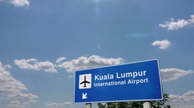 Jet uçağı Kuala Lumpur, Malezya 'ya iniyor. Havaalanı istikameti işaretli şehir gelişi. Seyahat, iş, turizm ve ulaşım konsepti. 3B canlandırma canlandırması.