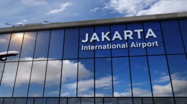 Jakarta, Endonezya 'ya jet uçağı iniyor. 3D animasyon. Cam havaalanı terminali ve uçağın yansıması ile şehre varış. Seyahat, iş, turizm ve ulaşım kavramı.