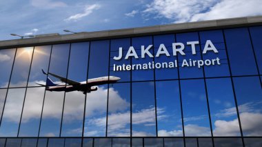 Jakarta, Endonezya 'ya iniş yapan bir jet uçağı. Cam havaalanı terminali ve uçağın yansıması ile şehre varış. Seyahat, iş, turizm ve ulaşım kavramı.