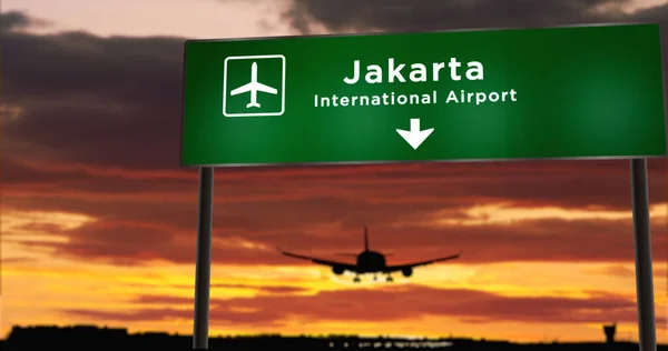 Silueta Avión Aterrizando Yakarta Indonesia Llegada Ciudad Con Letrero Dirección — Foto de Stock