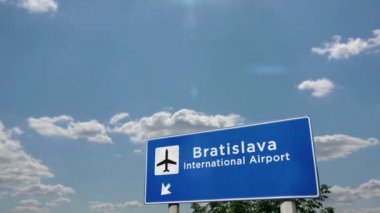 Jet uçağı Bratislava, Slovakya 'ya iniyor. Havaalanı istikameti işaretli şehir gelişi. Seyahat, iş, turizm ve ulaşım konsepti. 3B canlandırma canlandırması.