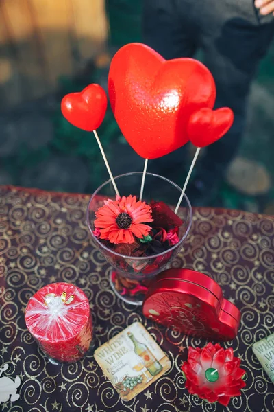 valentine day decor.love story. decorated table ,hearts , romantic dinner outside