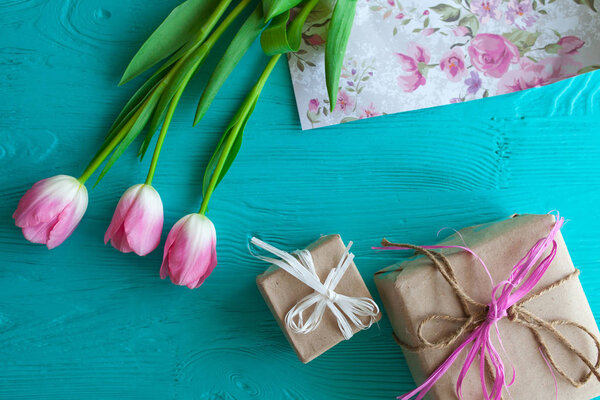 Mother's Day, woman's day. tulips ,presents on wooden background