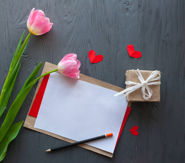 Wooden white background,letter and tulips. March 8, Mother's Day.