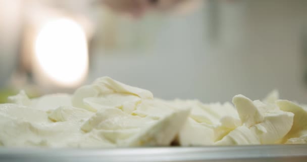 Spreading of cream cheese picks up a spoon. Close up slow motion — 비디오