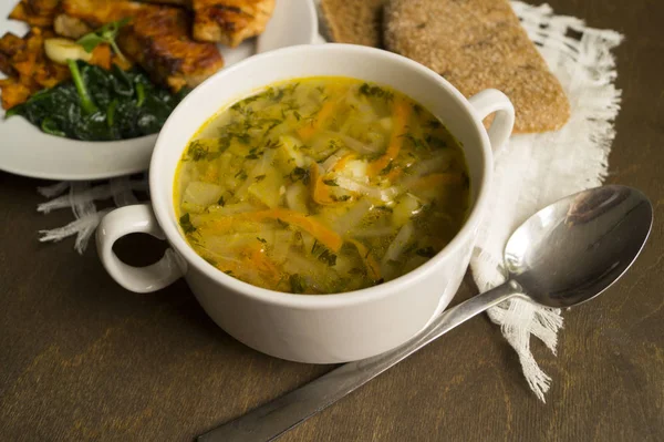 Cabbage soup, roasted Turkey with vegetables on wooden table. Sh — Stock Photo, Image