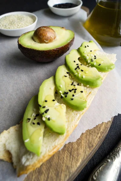 bread with avocado, olive oil and sesame seeds