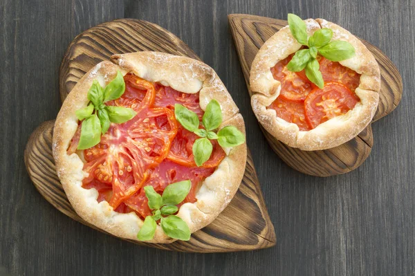 red tomato pie on a wooden Board.