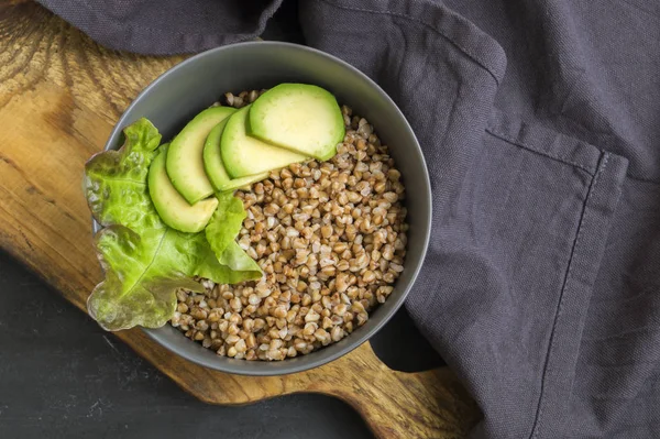 Healthy dish with buckwheat and vegetable salad. Buddha bowl. Ba