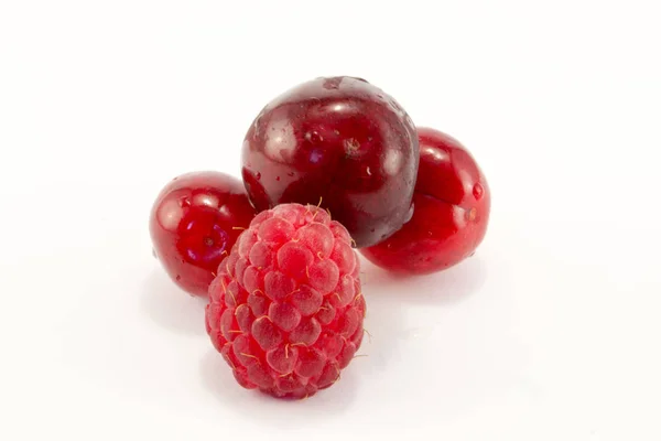 Raspberries with cherries — Stock Photo, Image