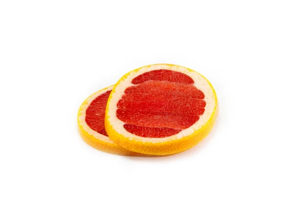 Грейпфрут нарезанный и сложенный — стоковое фото