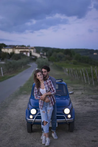 Young couple trip with vintage car