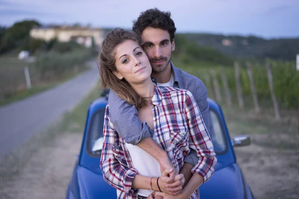 Young couple trip with vintage car