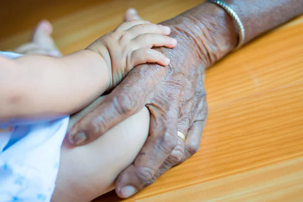 Hand Baby Hand Elderly Lady — Stock Photo, Image